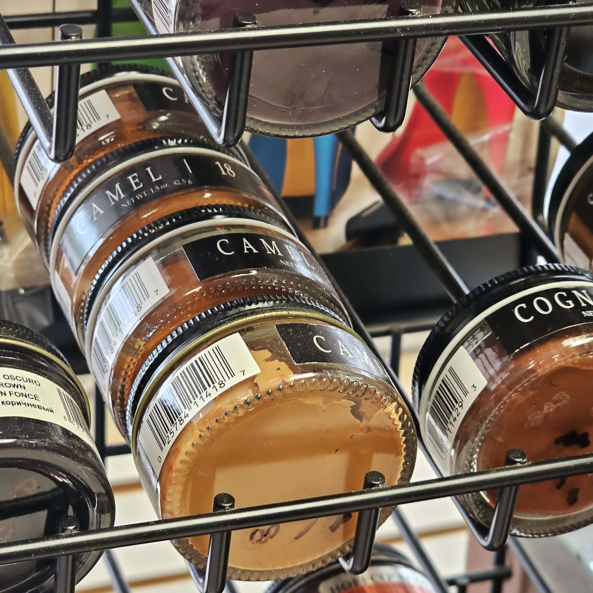 Jars of camel, cognac, and saddle shoe cream